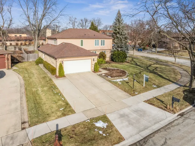 a view of a white house with a yard