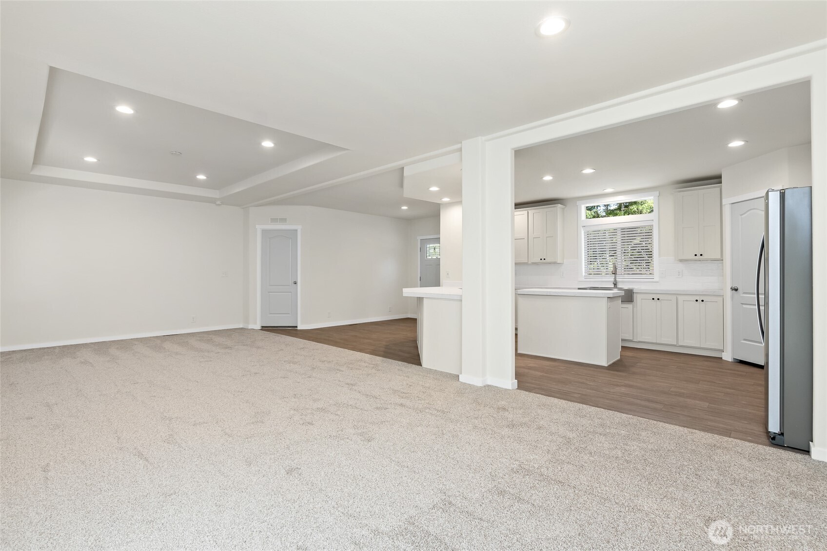 141 West Delight Park Road Shelton, WA 98584 - Photo 14 of 30 a view of a kitchen with white cabinets and wooden floors