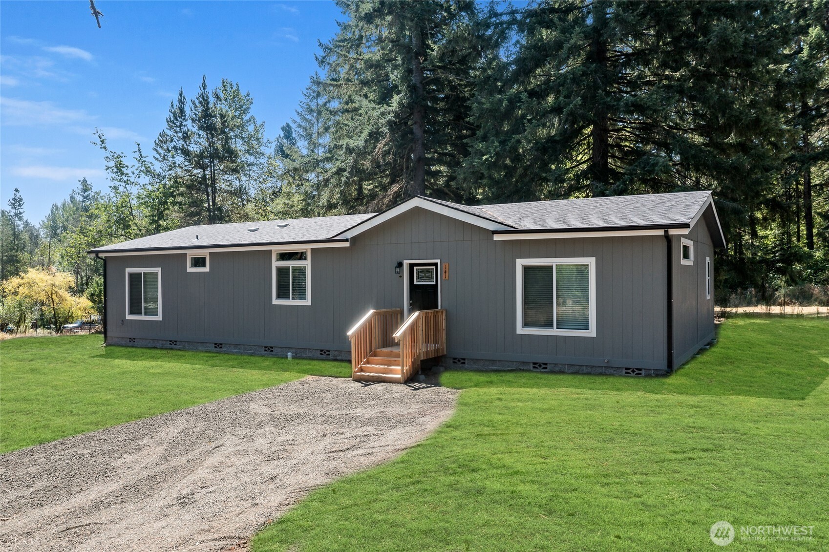 141 West Delight Park Road Shelton, WA 98584 - Photo 2 of 30 a front view of house with yard and trees in the background