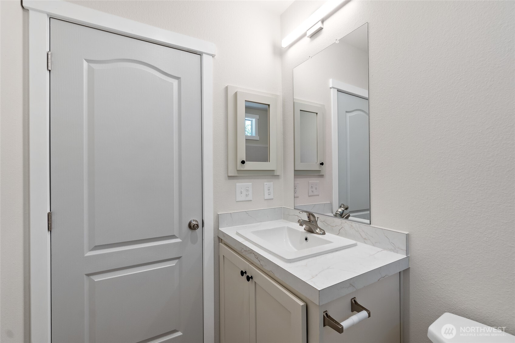 141 West Delight Park Road Shelton, WA 98584 - Photo 22 of 30 a bathroom with a sink a toilet and a mirror