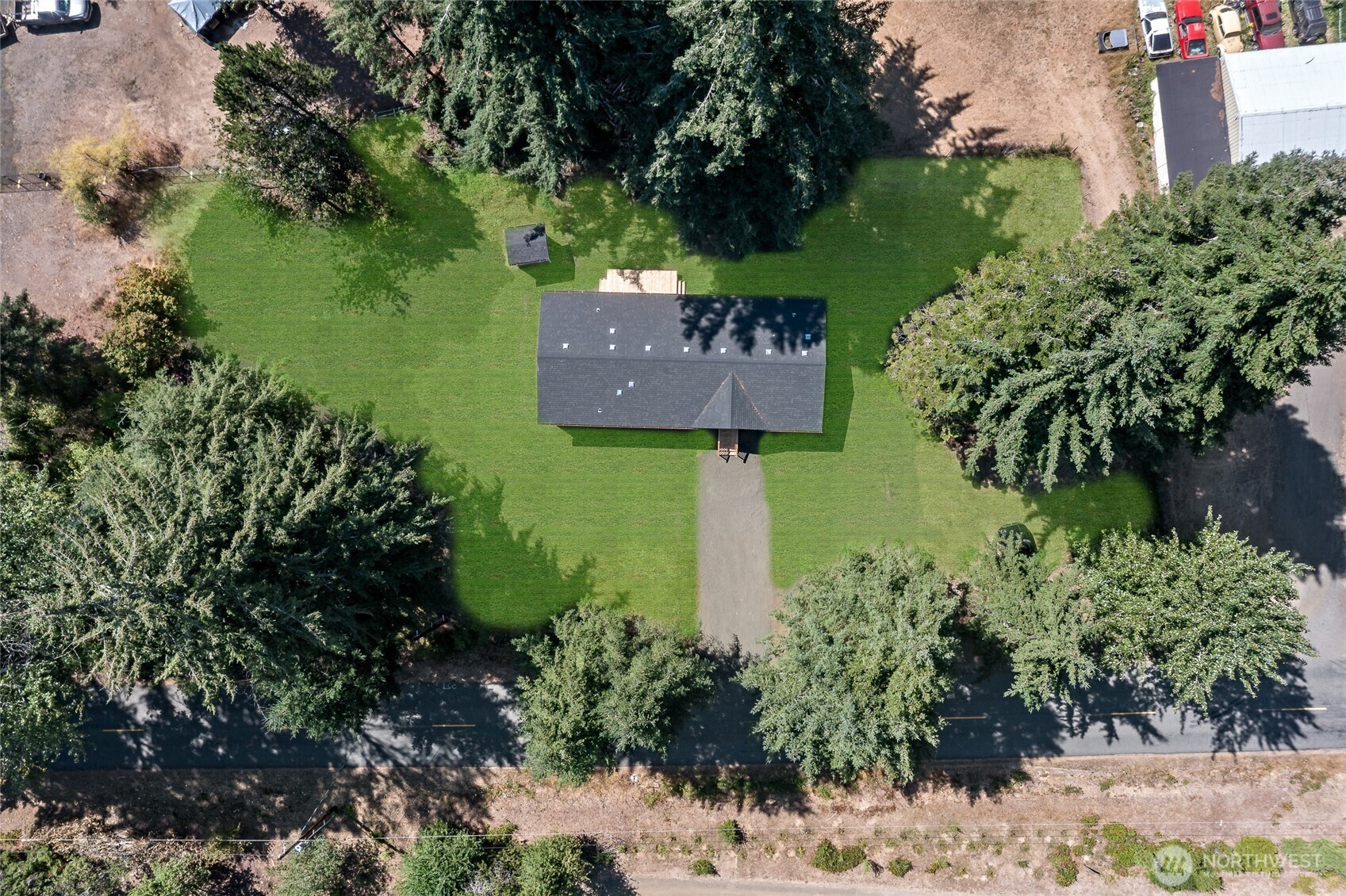 141 West Delight Park Road Shelton, WA 98584 - Photo 3 of 30 a sign that is sitting in front of flowers