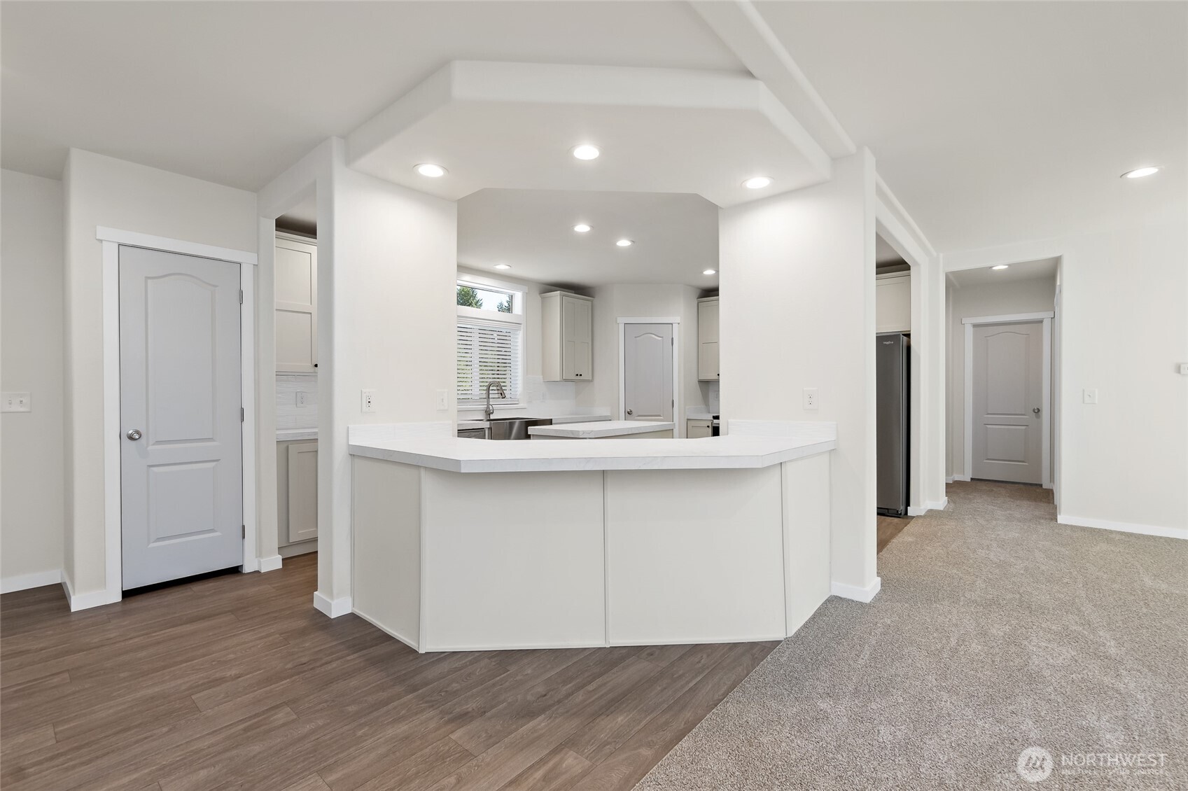 141 West Delight Park Road Shelton, WA 98584 - Photo 8 of 30 a view of a kitchen with kitchen island a sink stainless steel appliances and cabinets