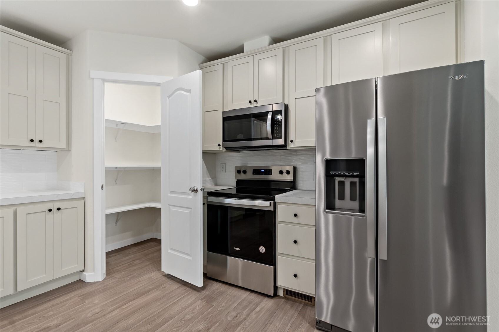 141 West Delight Park Road Shelton, WA 98584 - Photo 10 of 30 a kitchen with stainless steel appliances a refrigerator stove and microwave