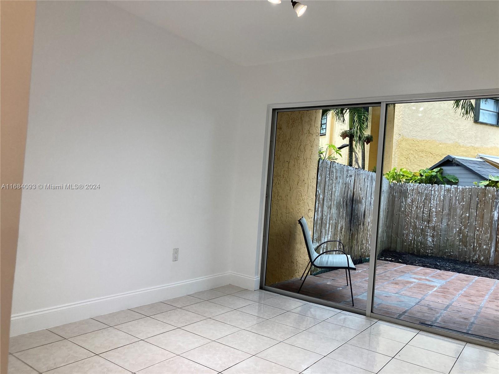 13731 Southwest 84th Street, Unit E Miami, FL 33143 - Photo 11 of 19 a view of a livingroom with furniture and staircase