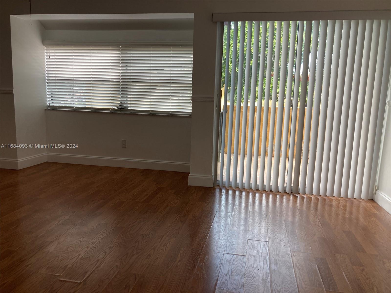 13731 Southwest 84th Street, Unit E Miami, FL 33143 - Photo 15 of 19 a view of a room that has a window in it