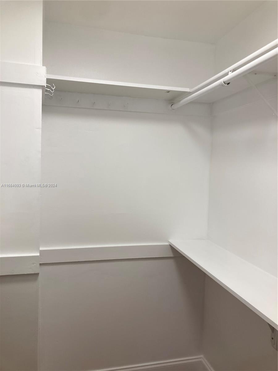 13731 Southwest 84th Street, Unit E Miami, FL 33143 - Photo 8 of 19 a view of an empty walk in closet