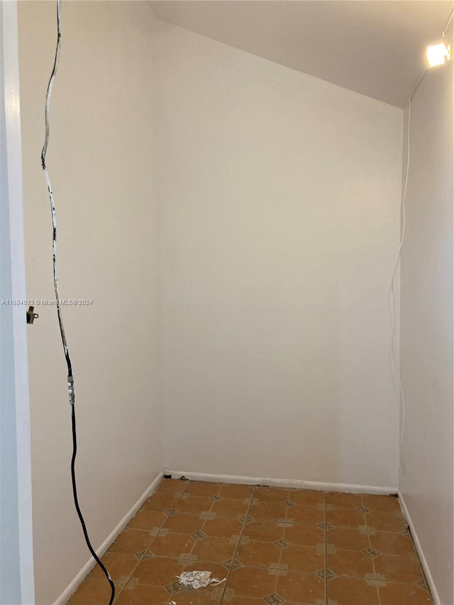 13731 Southwest 84th Street, Unit E Miami, FL 33143 - Photo 9 of 19 a view of small space with racks on the wall