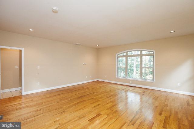 330 Morgan Road Cross Junction, VA 22625 - Photo 14 of 28 an empty room with wooden floor and windows