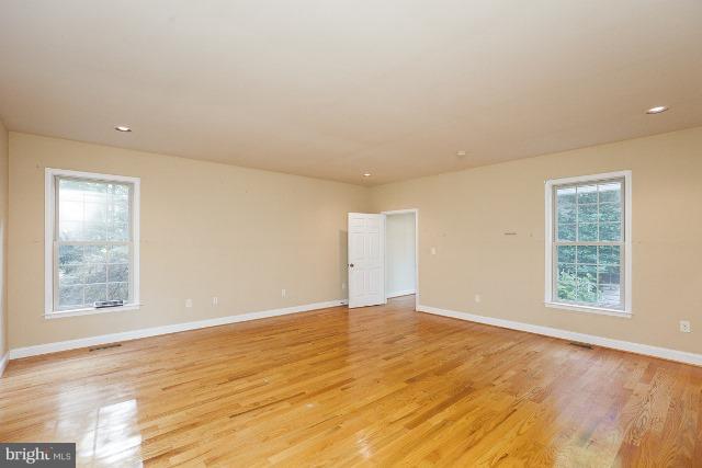 330 Morgan Road Cross Junction, VA 22625 - Photo 15 of 28 an empty room with wooden floor and windows