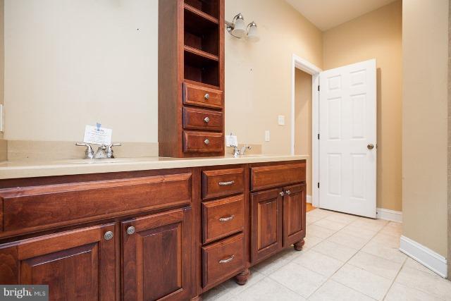 330 Morgan Road Cross Junction, VA 22625 - Photo 16 of 28 a bathroom with a sink a vanity and a large mirror