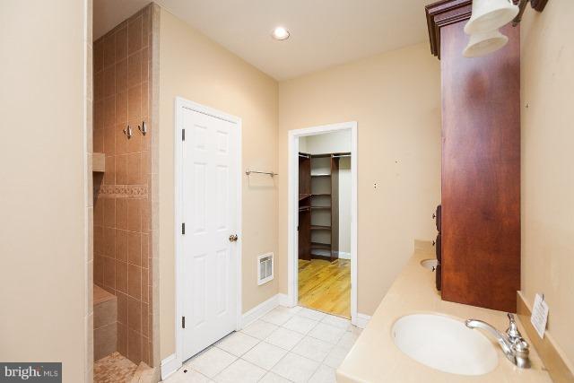 330 Morgan Road Cross Junction, VA 22625 - Photo 27 of 28 a bathroom with a sink and mirror or bathtub