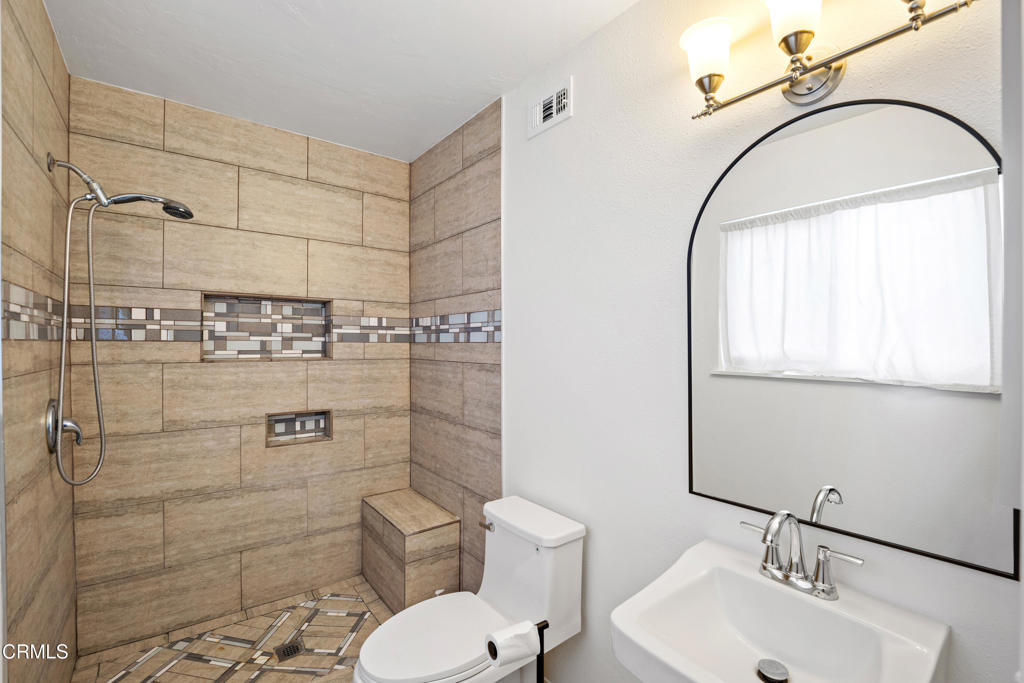 1511 Fathom Drive Oxnard, CA 93035 - Photo 17 of 29 a bathroom with a toilet sink shower and mirror