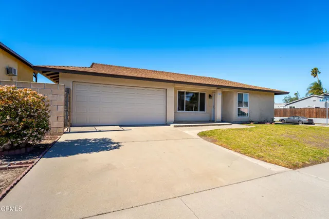 a front view of a house with a garage