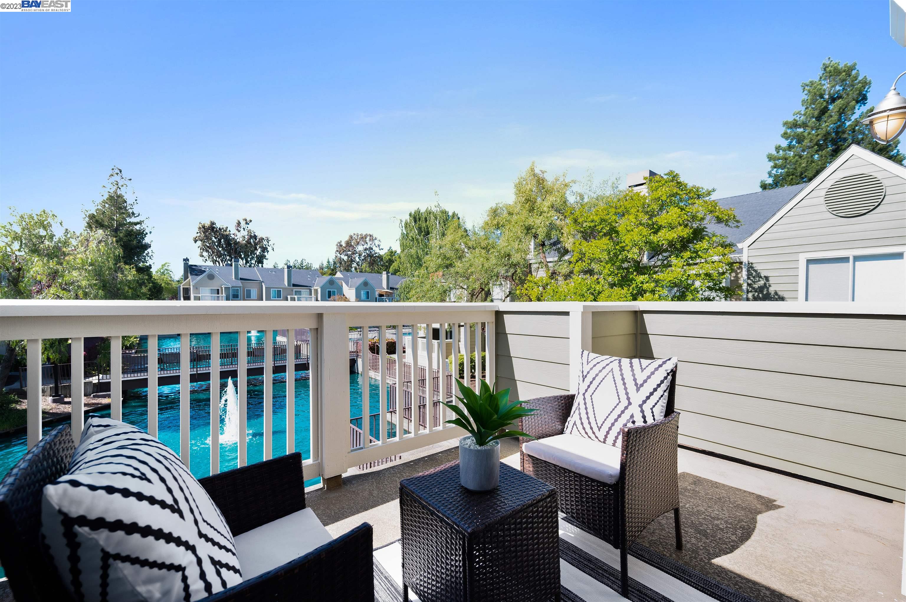 245 Reflections Drive, Unit 25 San Ramon, CA 94583 - Photo 1 of 1 a view of a chair and table on the balcony