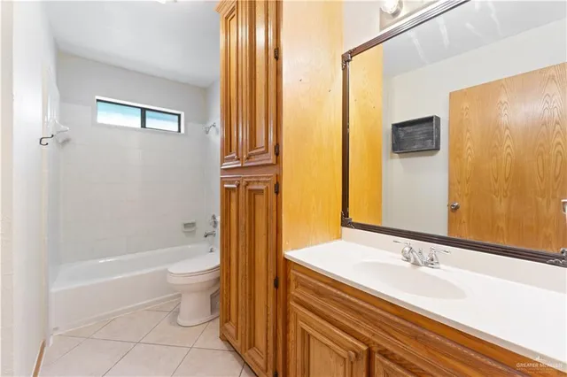 a bathroom with a bathtub and a sink