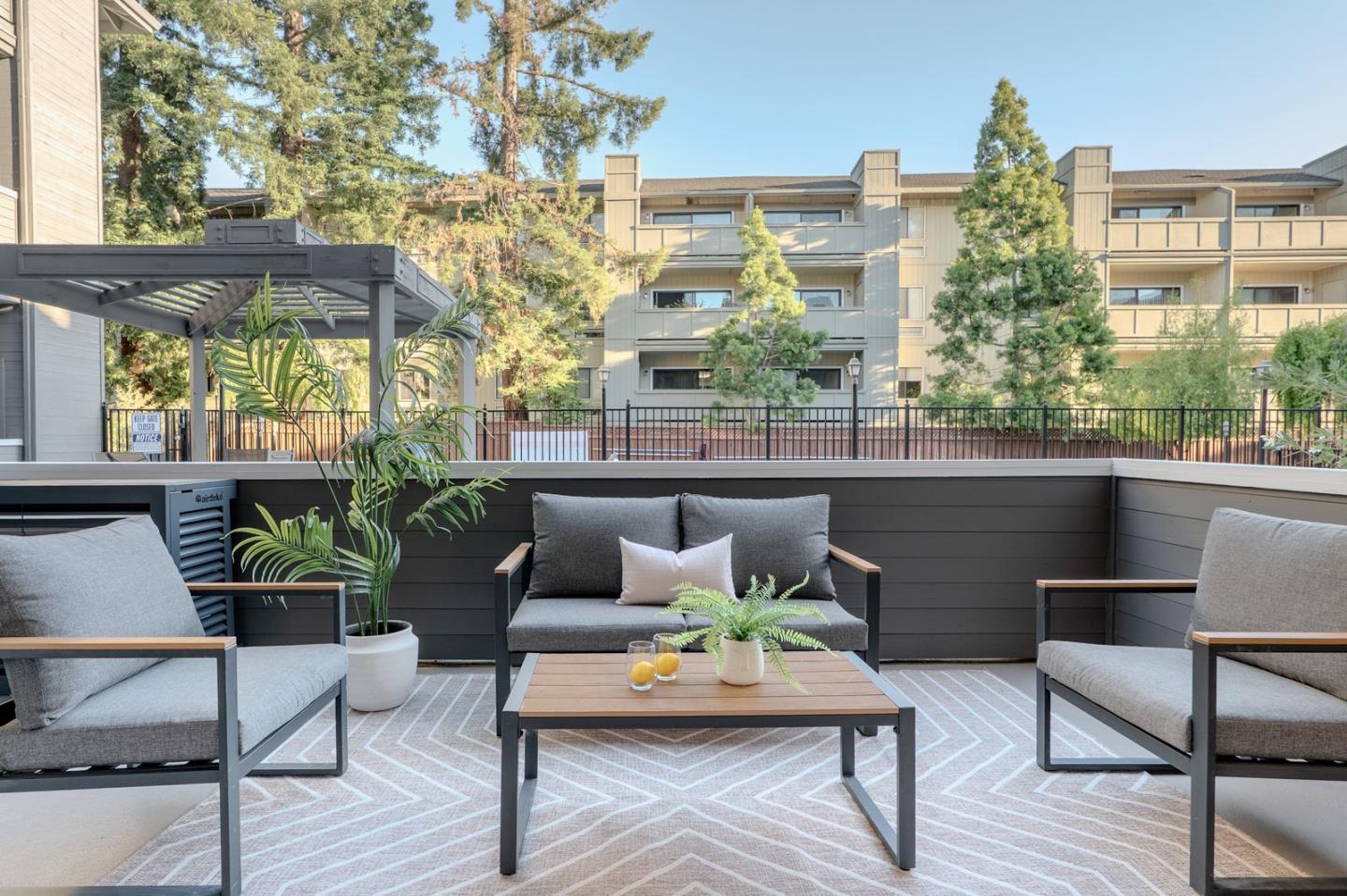 22330 Homestead Road, Unit 116 Cupertino, CA 95014 - Photo 11 of 30 a outdoor living room with furniture and wooden floor
