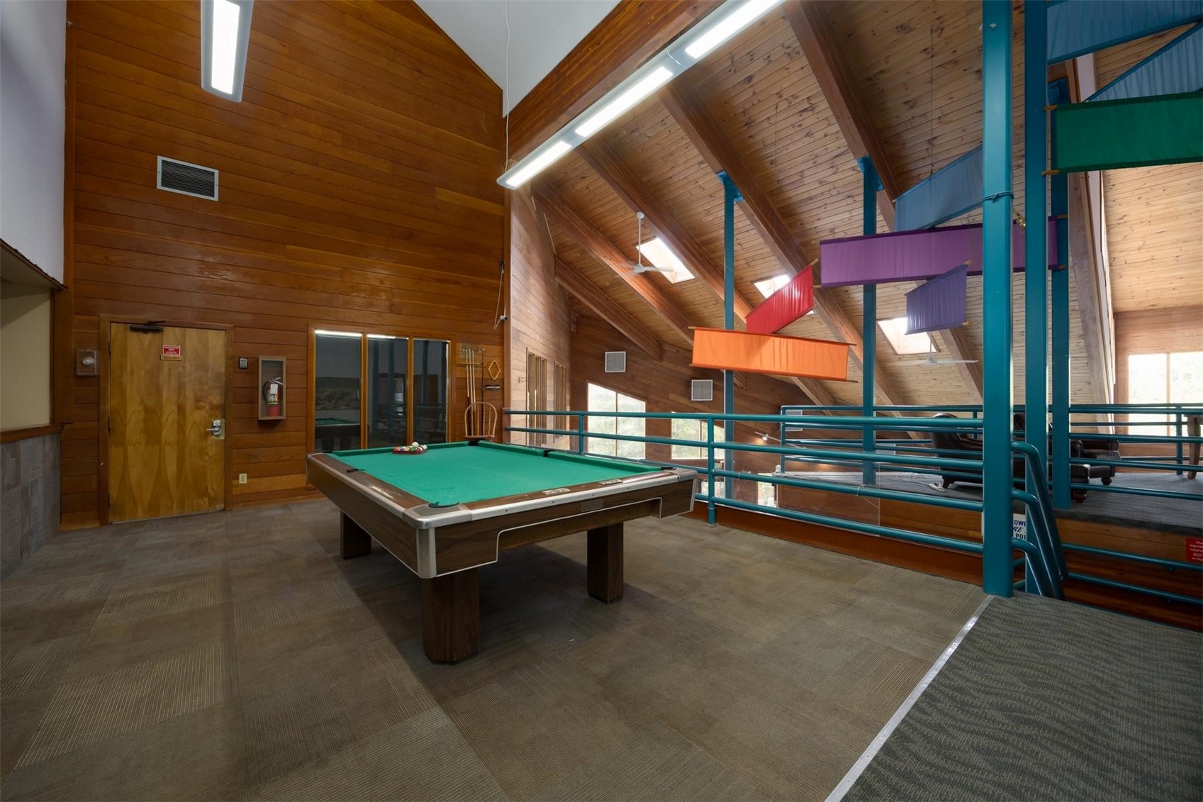 91100 Ryan Gulch Road, Unit 91105 Silverthorne, CO 80498 - Photo 42 of 49 a room with pool table and windows