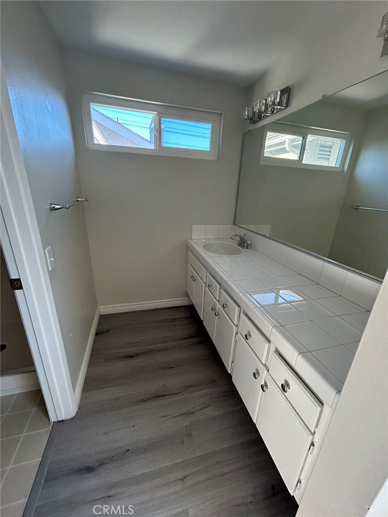 37 Butterfield Irvine, CA 92604 - Photo 7 of 9 a bathroom with double vanity sink and mirror