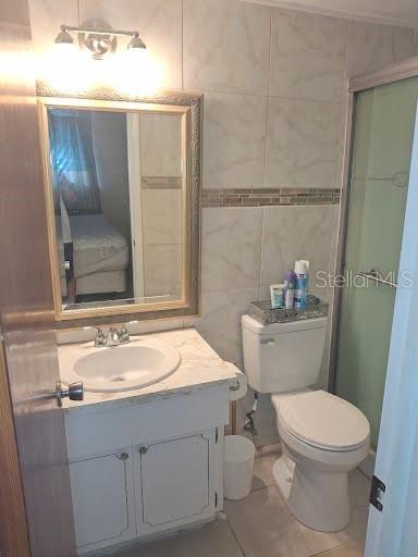 3600 Darlington Road Holiday, FL 34691 - Photo 12 of 20 a bathroom with a sink a toilet and shower