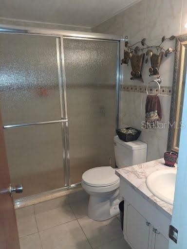 3600 Darlington Road Holiday, FL 34691 - Photo 13 of 20 a bathroom with a granite countertop sink toilet and shower