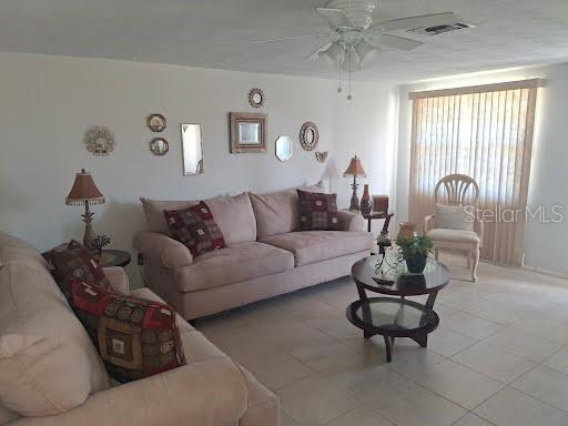 3600 Darlington Road Holiday, FL 34691 - Photo 2 of 20 a living room with furniture and a large window