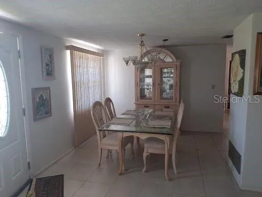 a view of a dining room with furniture and window
