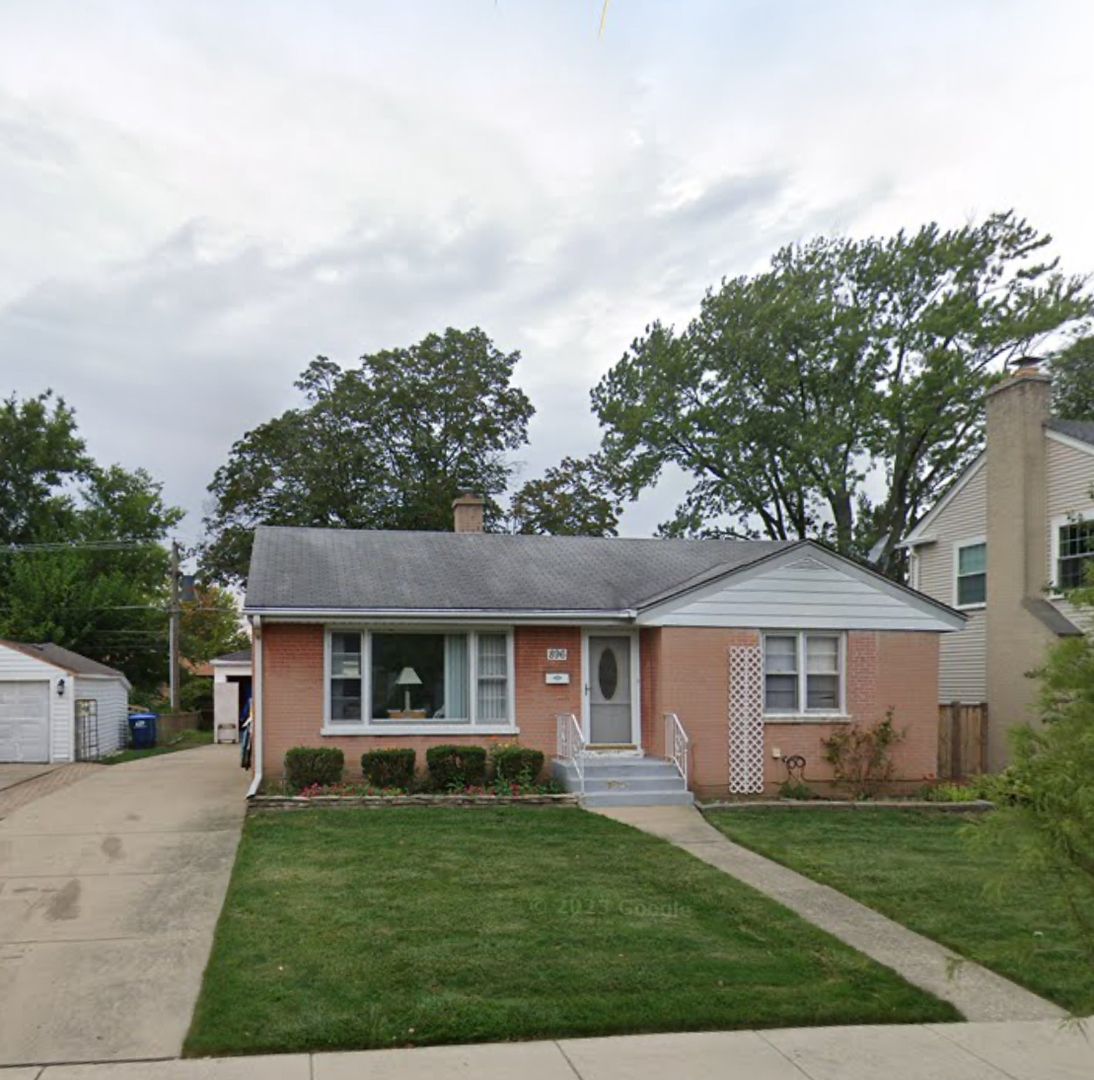896 Webster Lane Des Plaines, IL 60016 - Photo 1 of 1 a front view of a house with a garden