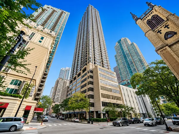 a city street lined with buildings and trees
