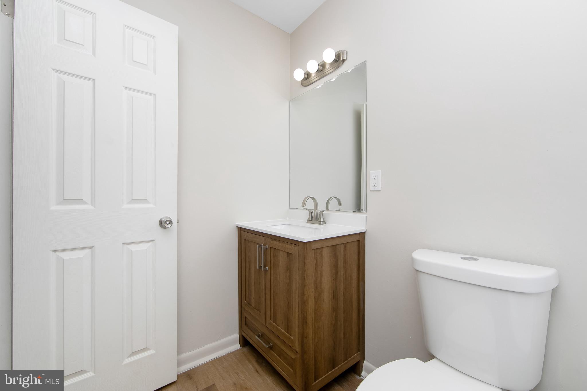 222 Echelon Road Voorhees, NJ 08043 - Photo 21 of 29 a bathroom with a toilet a sink and mirror