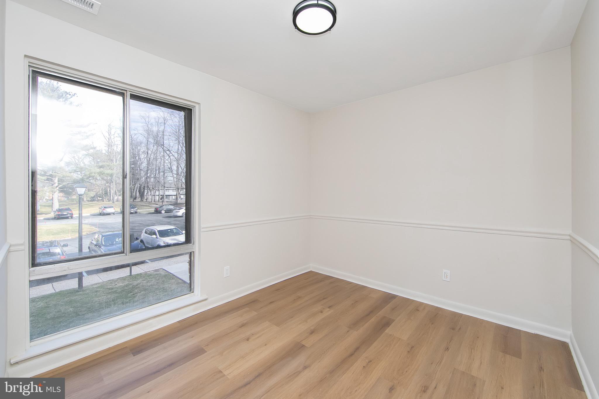 222 Echelon Road Voorhees, NJ 08043 - Photo 7 of 29 a view of a room with wooden floor and doors