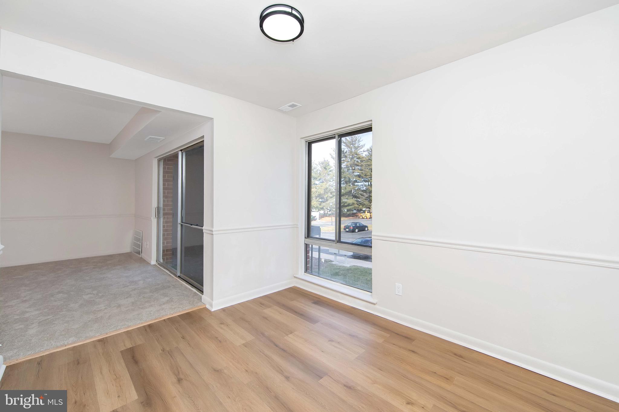 222 Echelon Road Voorhees, NJ 08043 - Photo 8 of 29 an empty room with wooden floor and windows