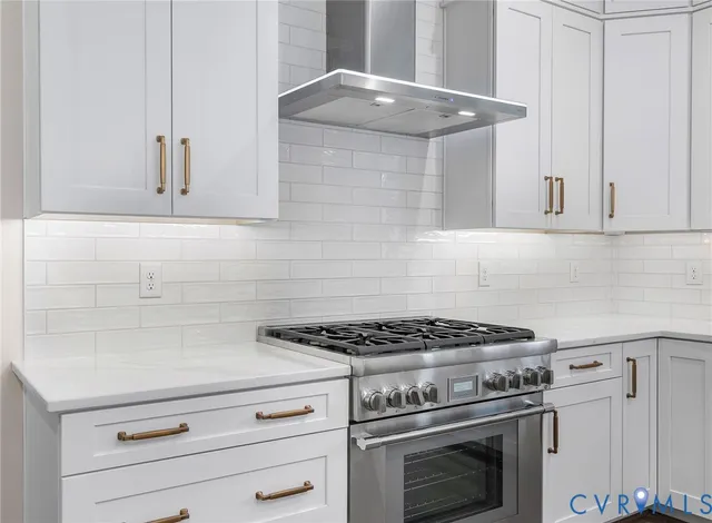a close view of a refrigerator and an stove in kitchen