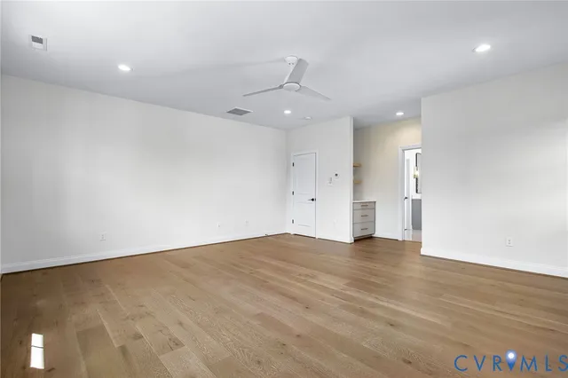 a spacious bathroom with a tub a sink and shower