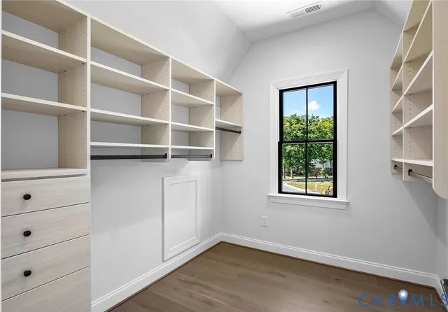 a view of an empty walk in closet