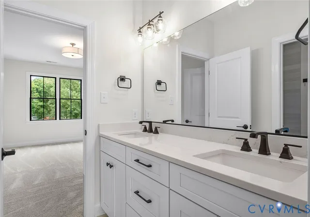 a bathroom with a white bath tub and a shower