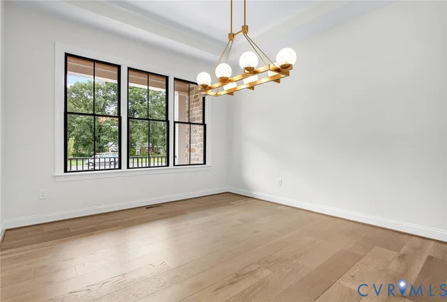 a view of a livingroom with a ceiling fan and window