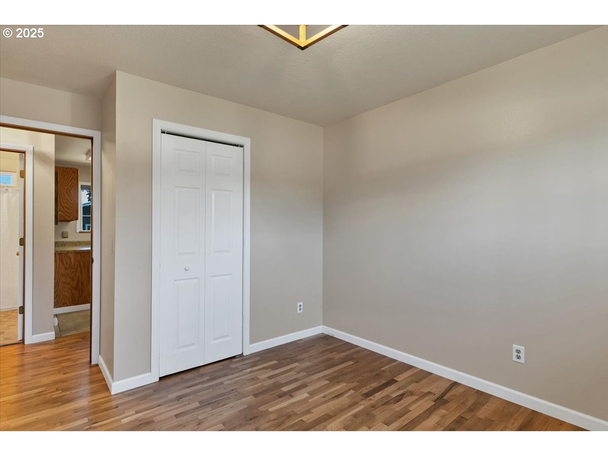 224 South 24th Street Philomath, OR 97370 - Photo 25 of 46 a view of an empty room and wooden floor