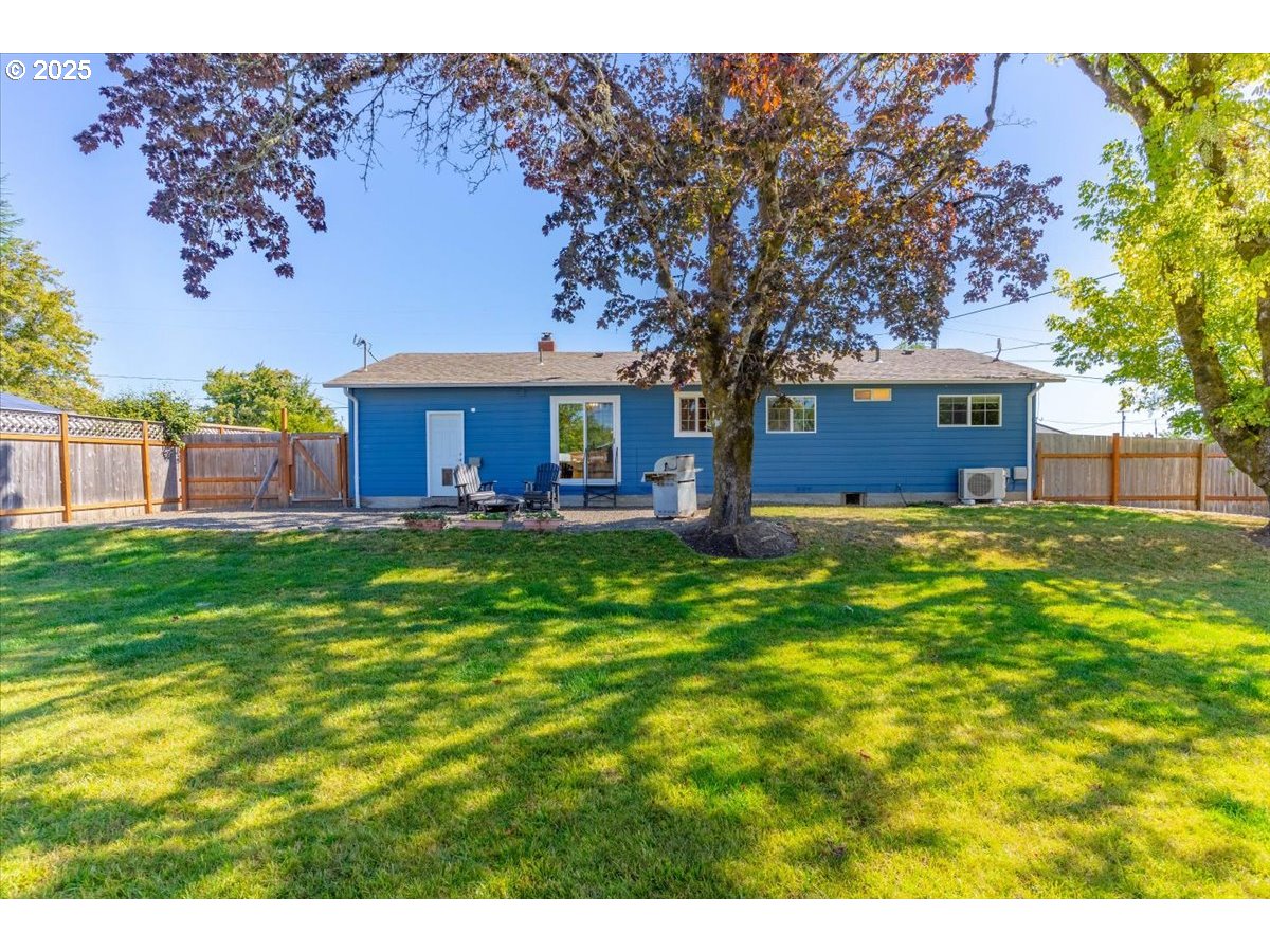 224 South 24th Street Philomath, OR 97370 - Photo 37 of 46 a view of a house with a big yard potted plants and large tree