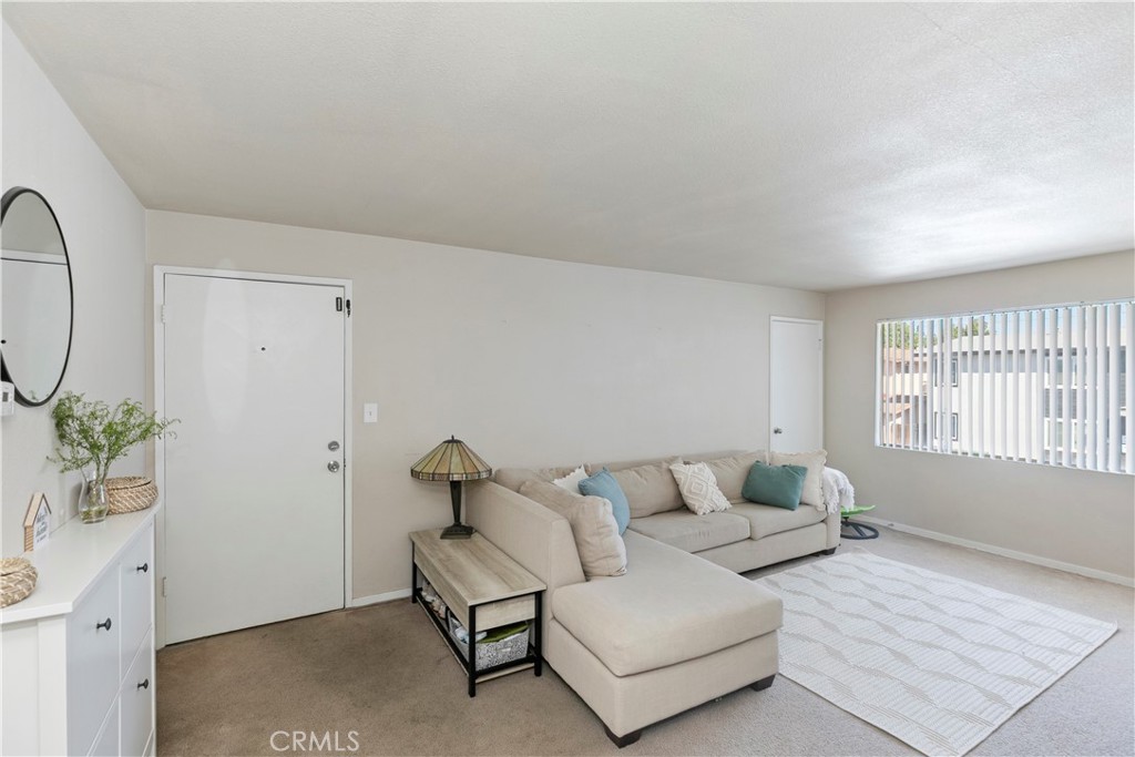 114 Juniper Street Brea, CA 92821 - Photo 20 of 64 a living room with furniture and a potted plant on the dresser