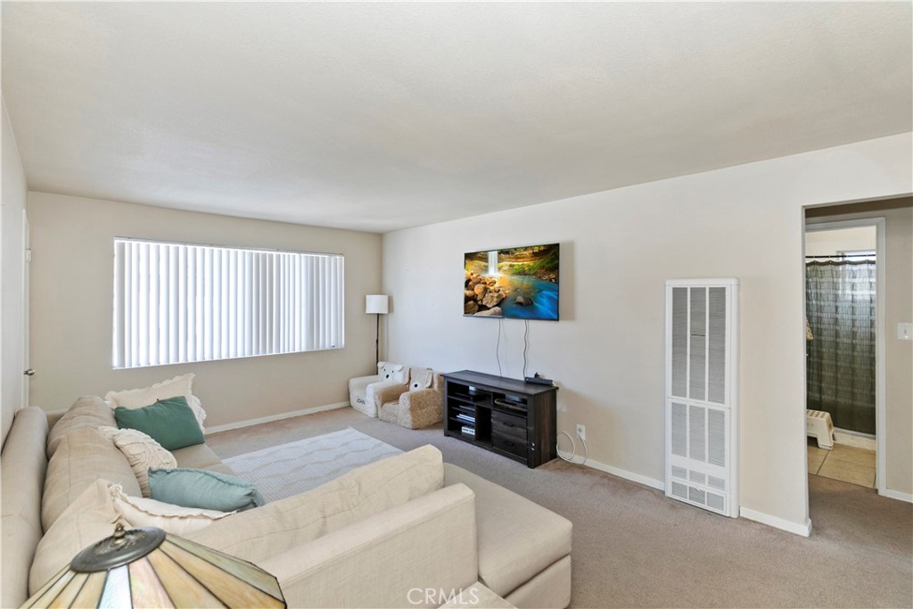 114 Juniper Street Brea, CA 92821 - Photo 23 of 64 a living room with furniture and a flat screen tv