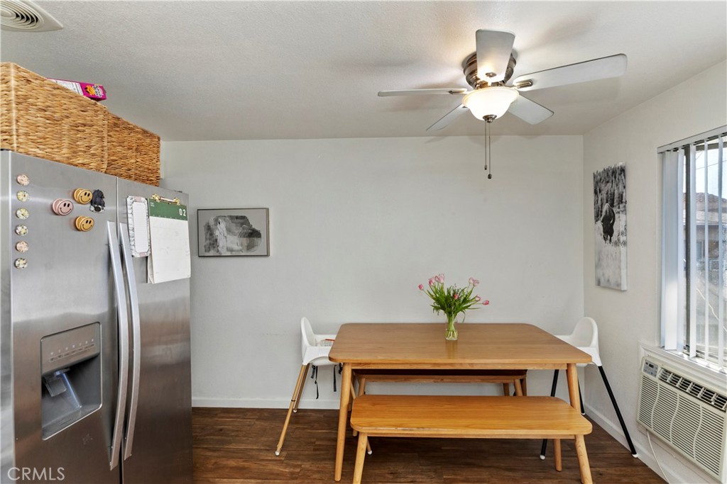 114 Juniper Street Brea, CA 92821 - Photo 26 of 64 a view of a dining room with furniture wooden floor and a chandelier