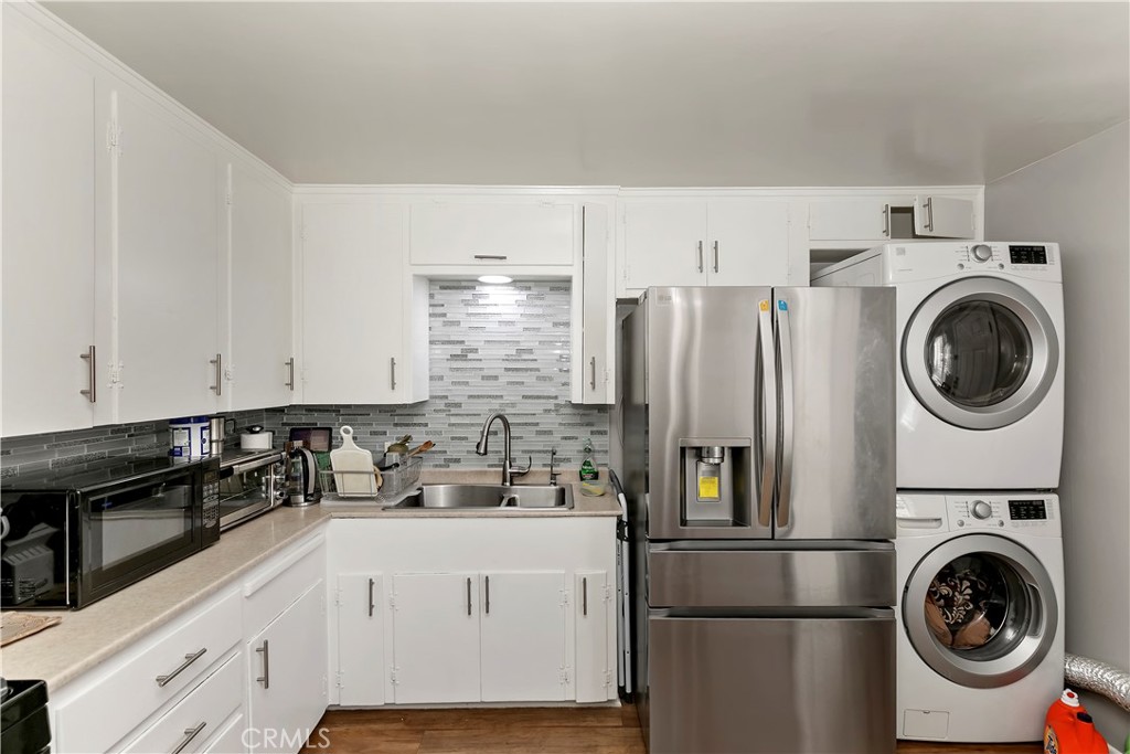 114 Juniper Street Brea, CA 92821 - Photo 40 of 64 a kitchen with a refrigerator and a stove top oven