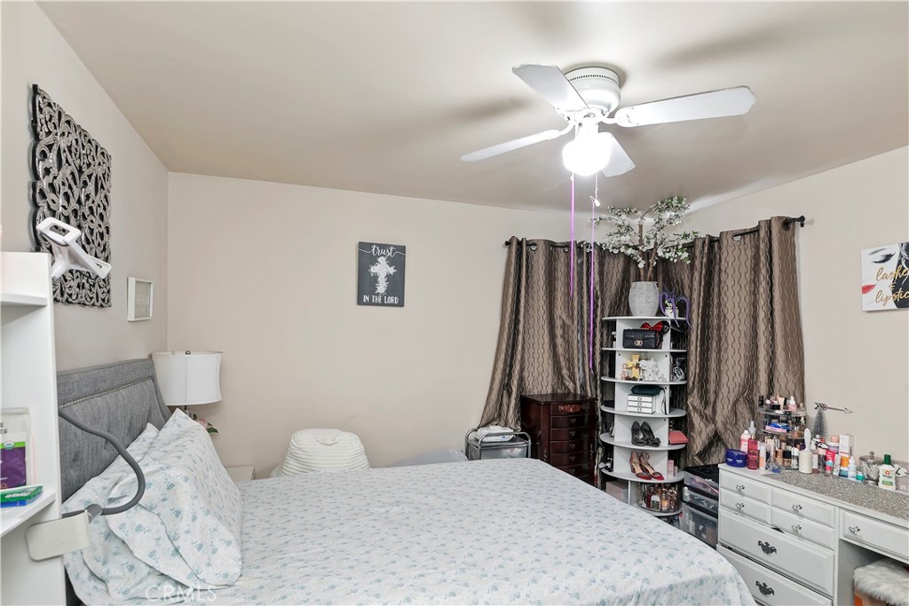 114 Juniper Street Brea, CA 92821 - Photo 51 of 64 a bedroom with a bed and a chandelier