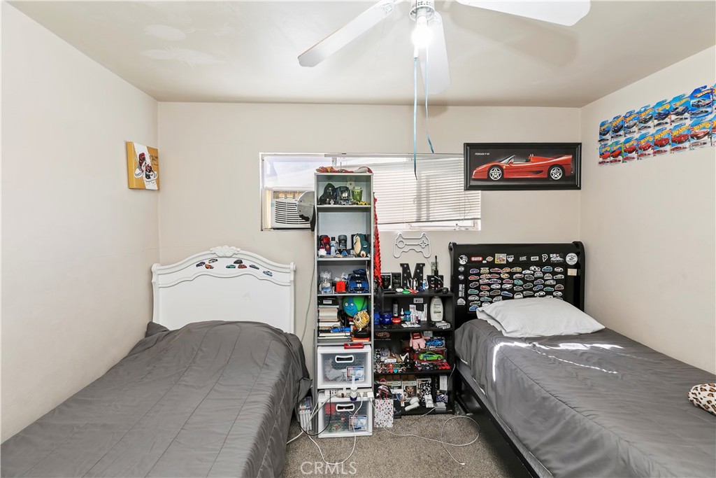 114 Juniper Street Brea, CA 92821 - Photo 52 of 64 a bedroom with a bed and a table