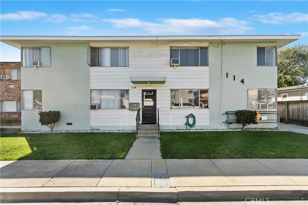 114 Juniper Street Brea, CA 92821 - Photo 62 of 64 a front view of a house with a yard and garage