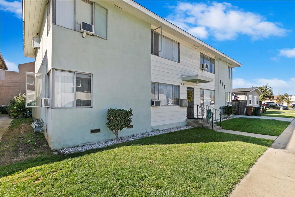 114 Juniper Street Brea, CA 92821 - Photo 64 of 64 a front view of a house with a garden and yard