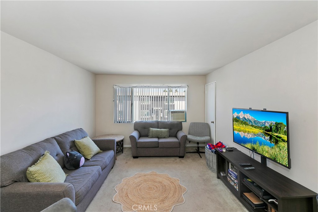 114 Juniper Street Brea, CA 92821 - Photo 7 of 64 a living room with furniture a couch and a flat screen tv