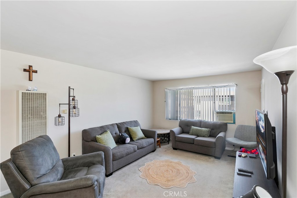 114 Juniper Street Brea, CA 92821 - Photo 8 of 64 a living room with furniture a flat screen tv and a window