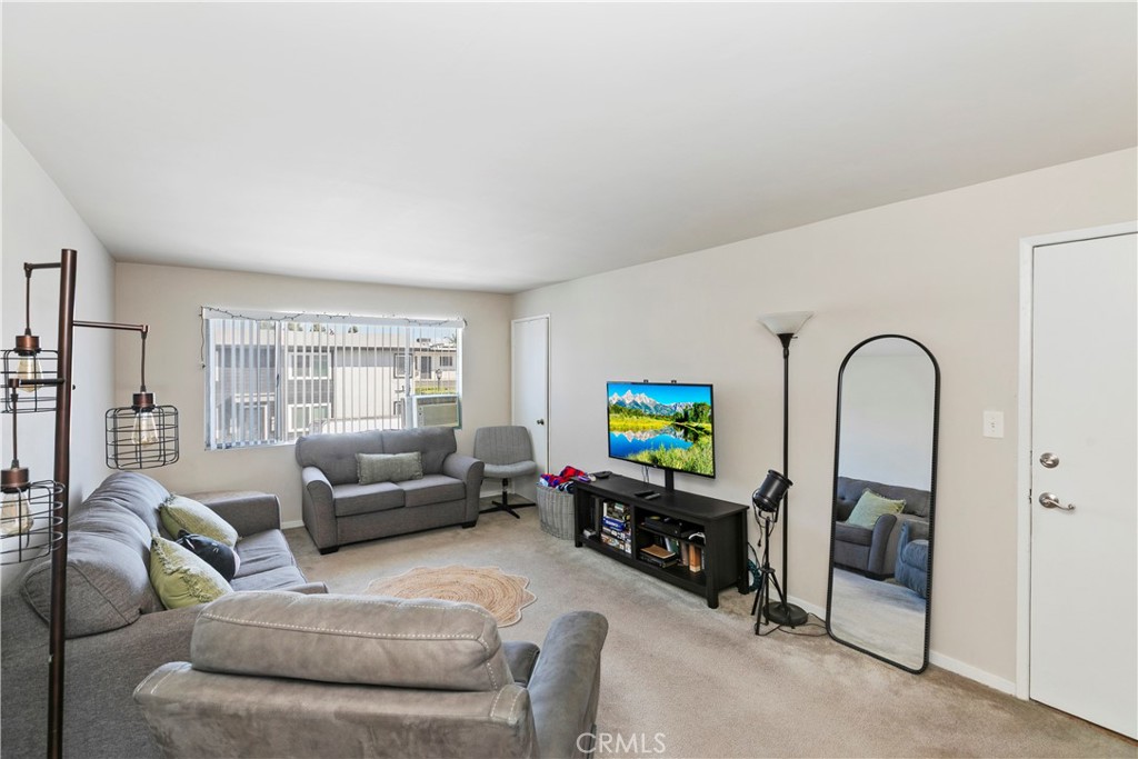 114 Juniper Street Brea, CA 92821 - Photo 9 of 64 a living room with furniture and a flat screen tv
