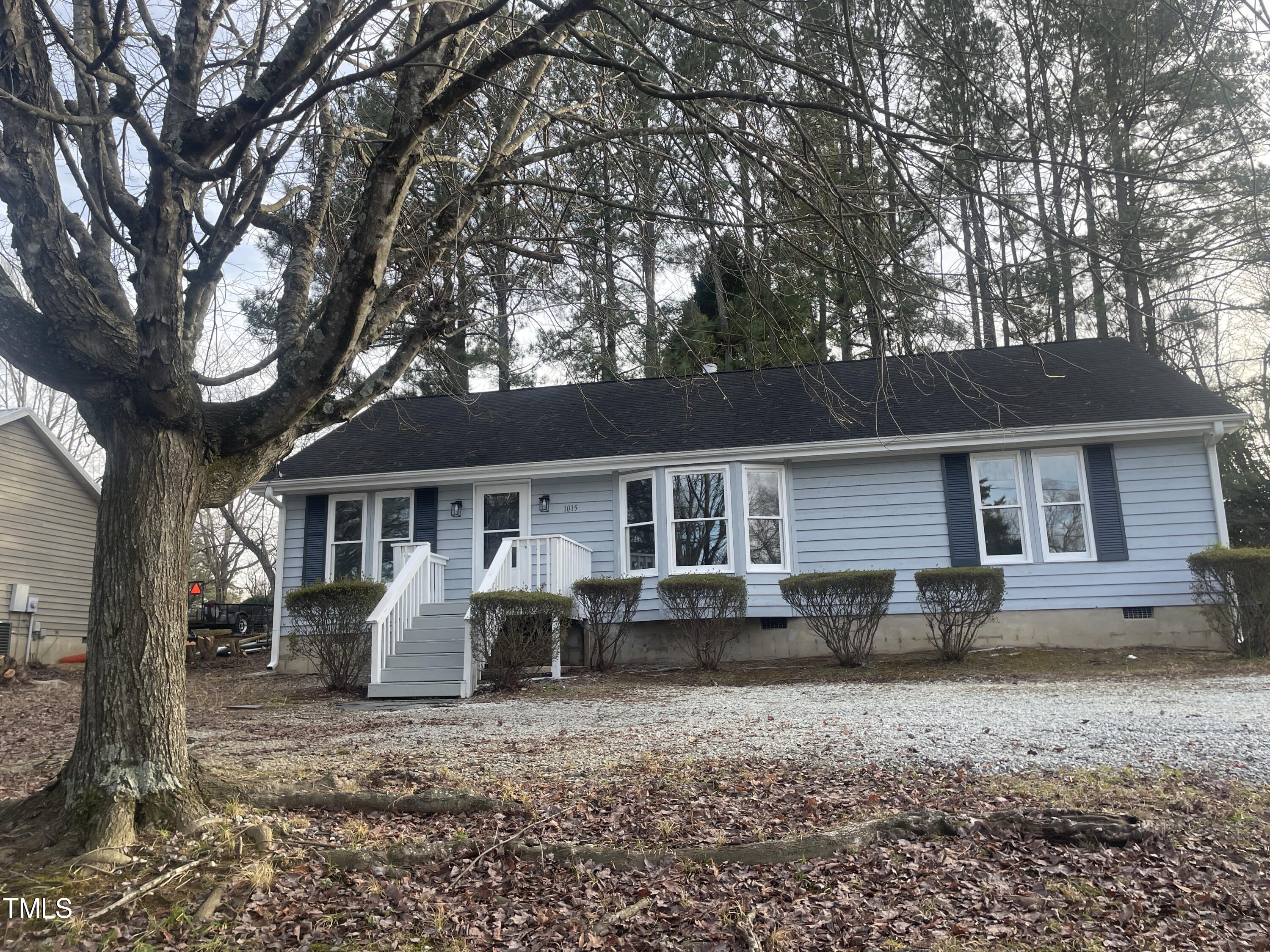 1015 Horton Road Durham, NC 27704 - Photo 2 of 15 a view of a house with a chairs in a patio